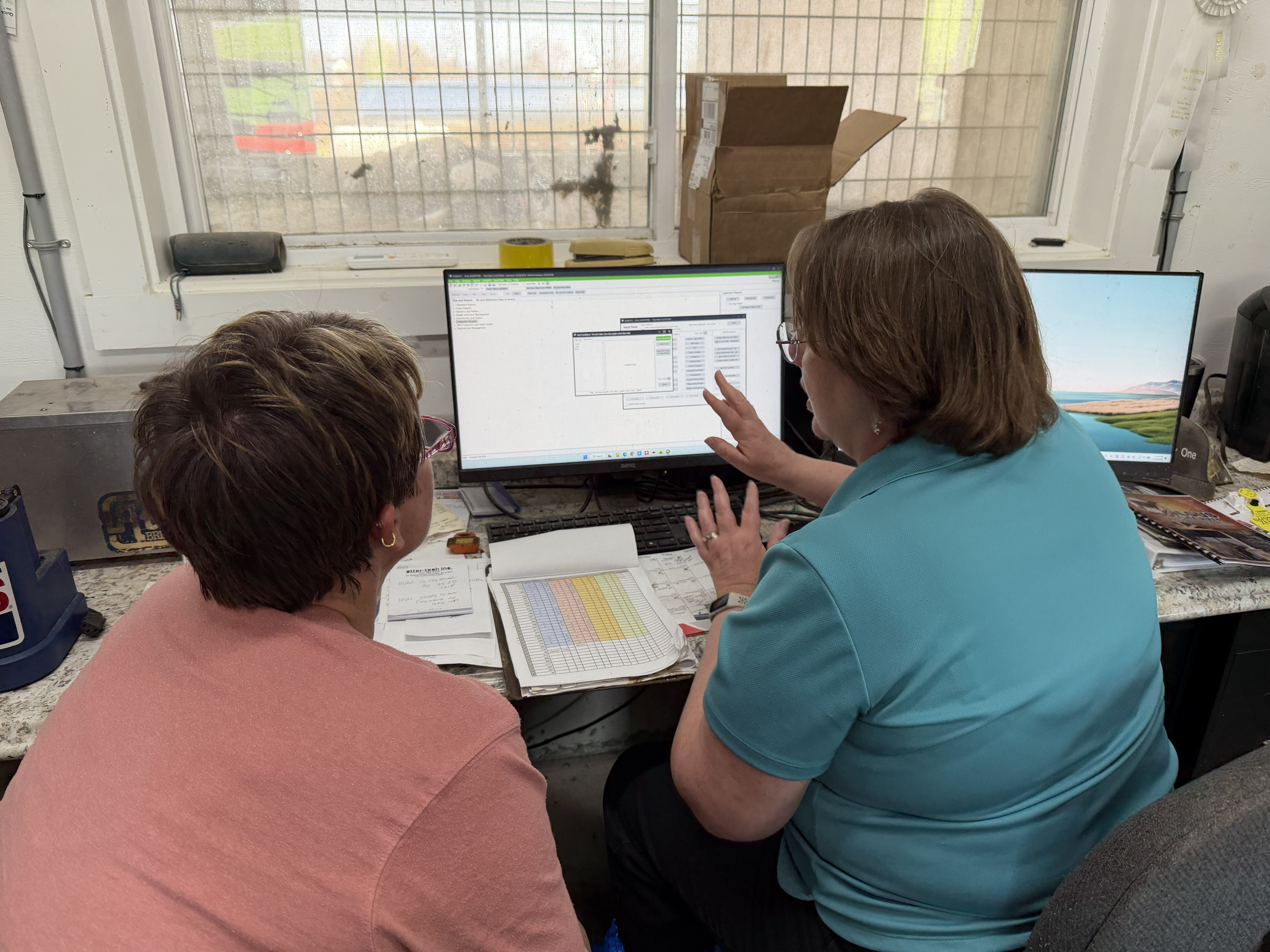 Tammie and producer using Dart in office